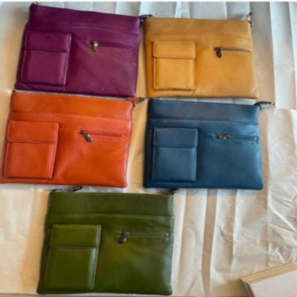 Cell phone pocket zipper cross over bag